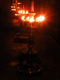An arrangement of brass oil lamps